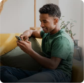 A young man reading pre-appointment reminder email message instructions.